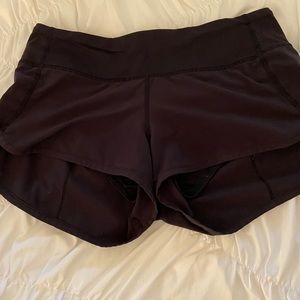 Black Lululemon speed up short. Size 4.